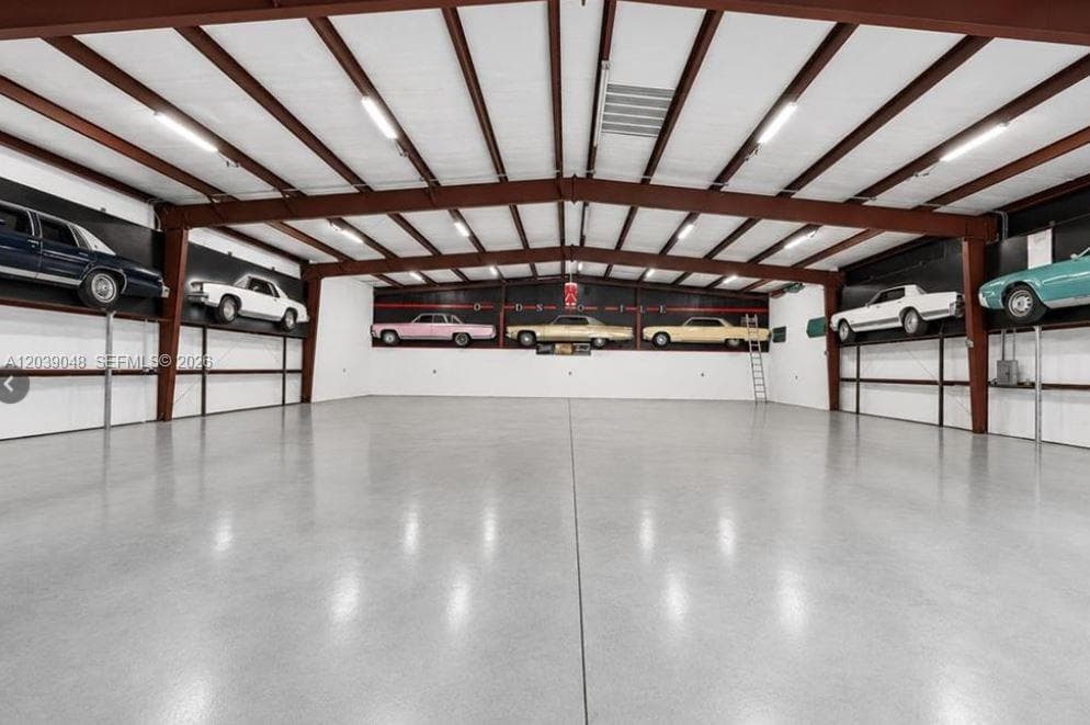 Garage building offering separation of use and expanded storage capability.