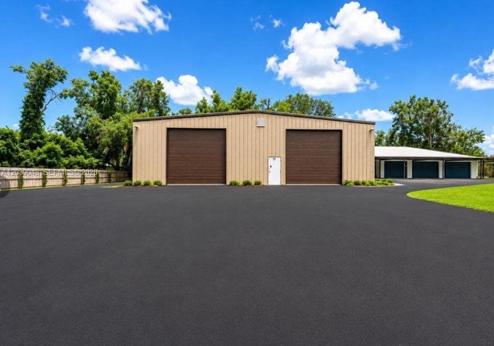 Oversized detached garage structure offering substantial capacity for vehicles, equipment, or workshop use. Ideal for collectors, contractors, or storage-intensive needs.
