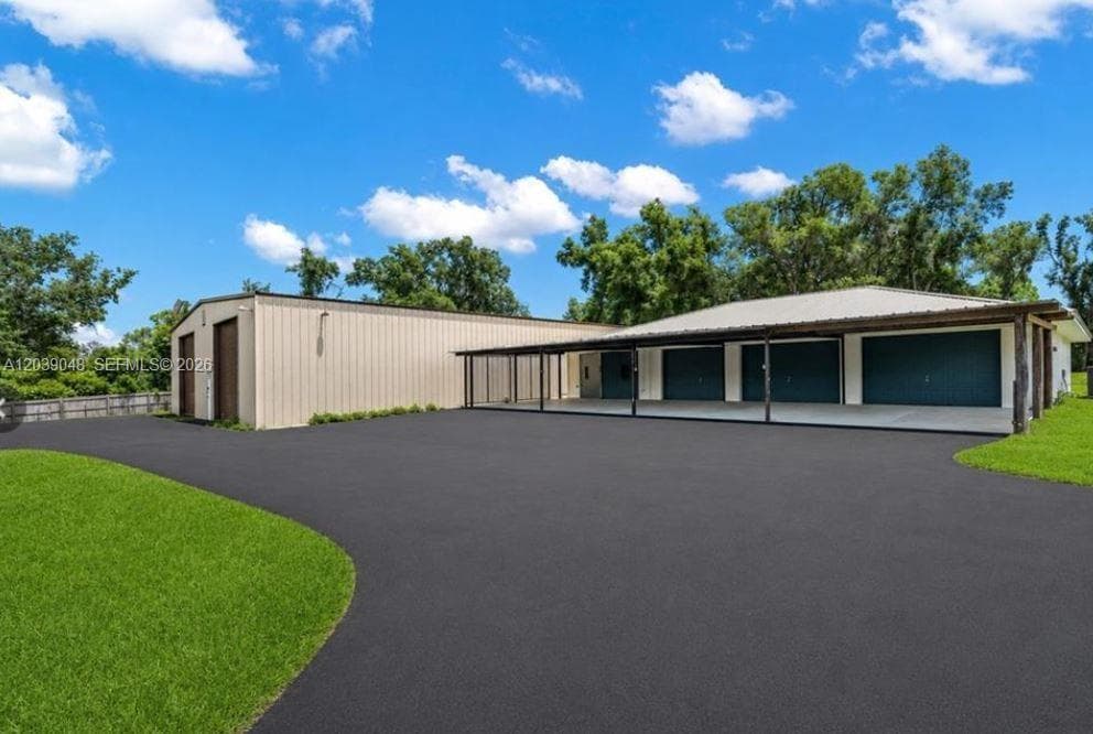 Second detached garage building providing additional covered storage and workspace, enhancing functionality and flexibility across the property.