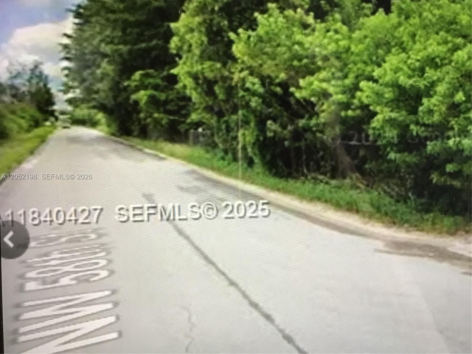 Main road leading to the entrance of N.W. 119th Avenue