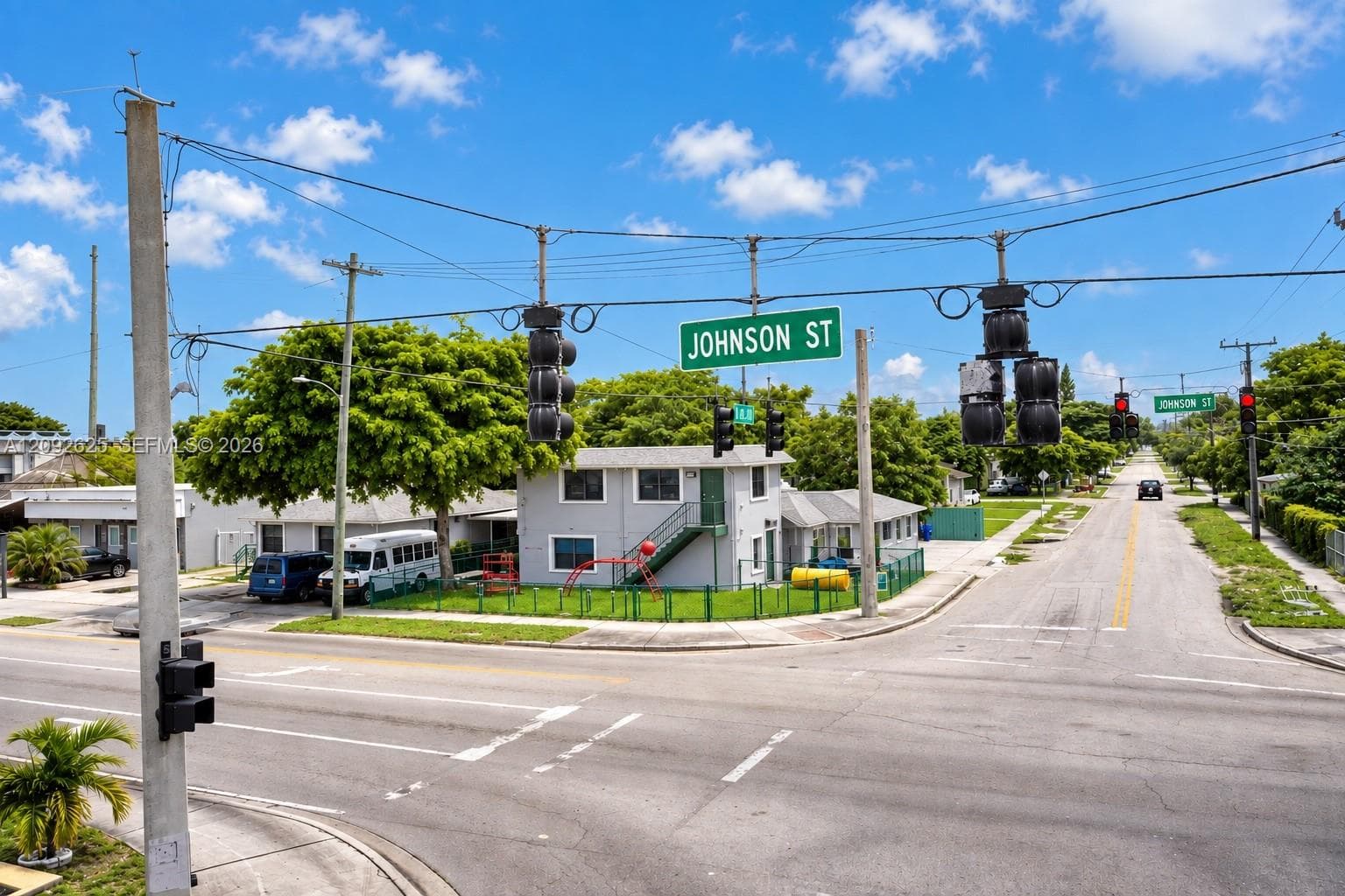 Corner View from Johnson Street & N 62nd Avenue – Two Adjacent Freestanding Buildings with Prominent Street Frontage