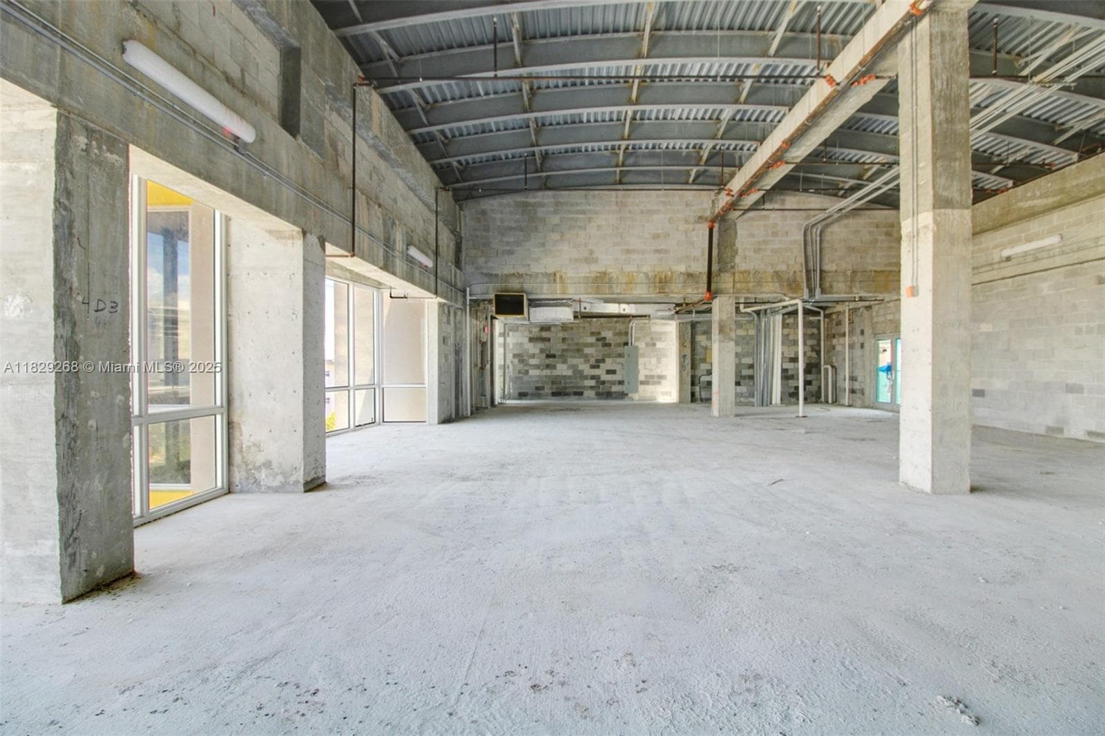 High vaulted and arched ceilings for a potential loft-office feel. Serviced by two elevators.