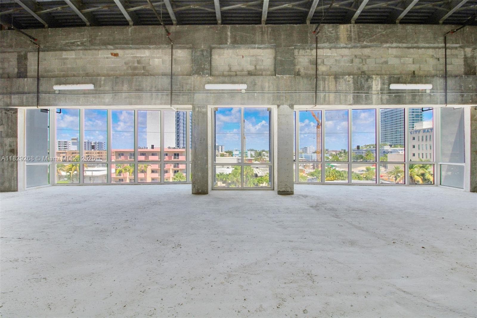 Wall of windows facing west with view.