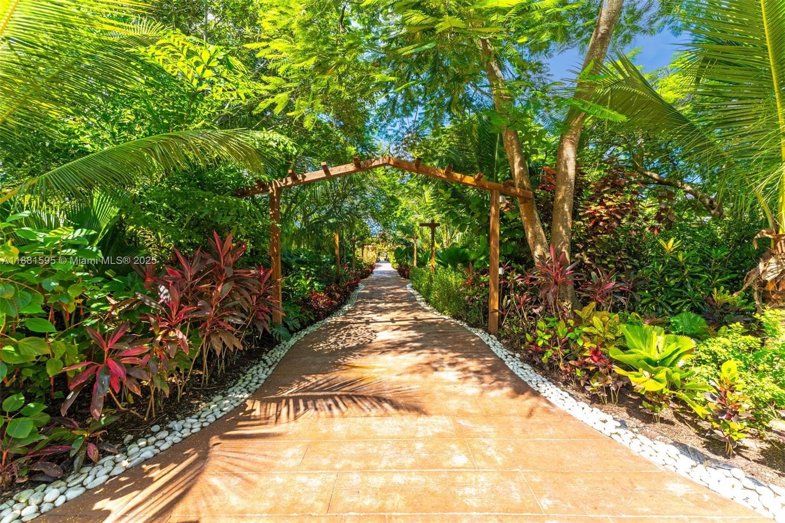 MAIN walkway to lg tiki .PLUS 2 SMALLER ONES......THE LIGHTING IS GORGEOUS AT NIGHT AND GREAT COLOR DURING THE DAY.... THE ADJACENT 2ND TIKI IS USED FOR BUFFET AND 3RD BAR