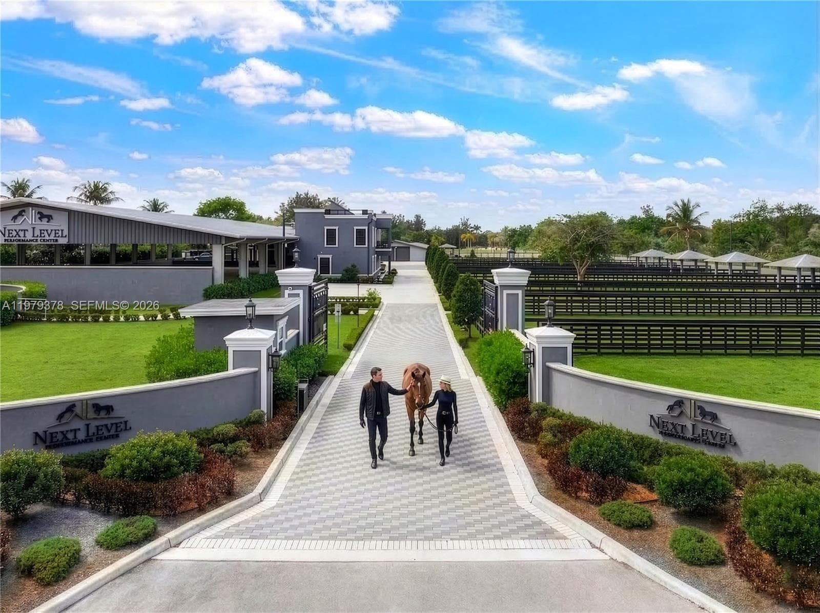 Electric gated entrance with security guard house.