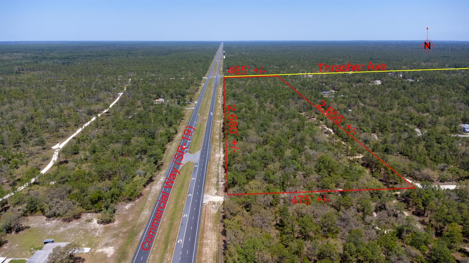 Red_sign_31_acres_lot_Thrasher_Ave_Weeki
