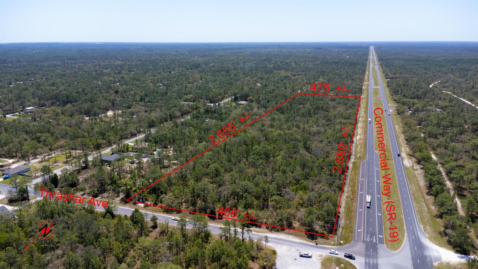 Red_sign_31_acres_lot_Thrasher_Ave_Weeki