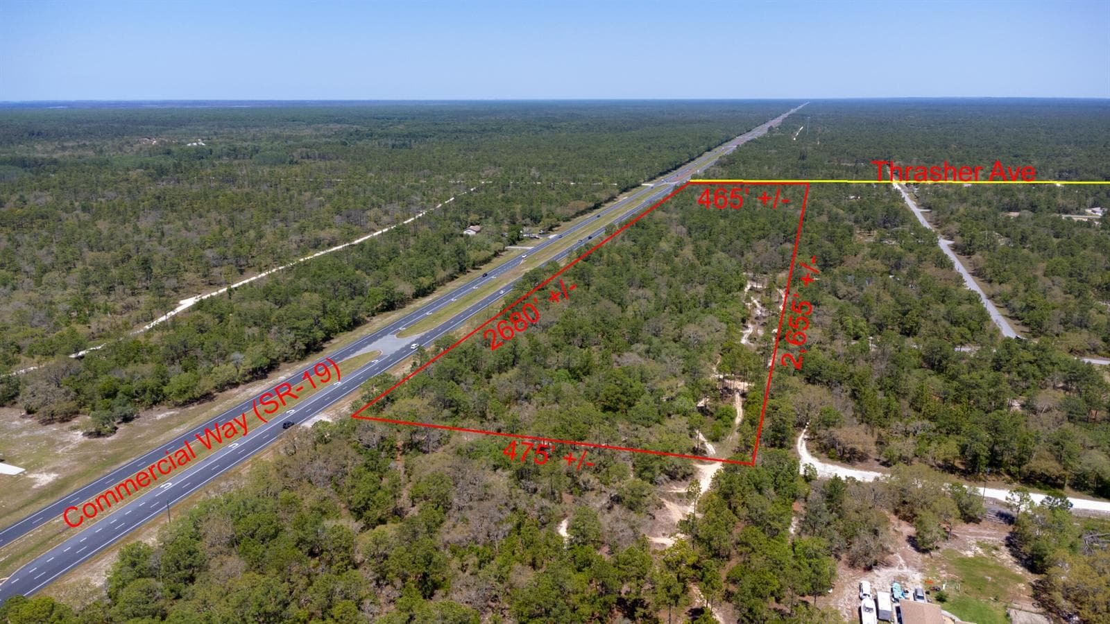 Red_sign_31_acres_lot_Thrasher_Ave_Weeki