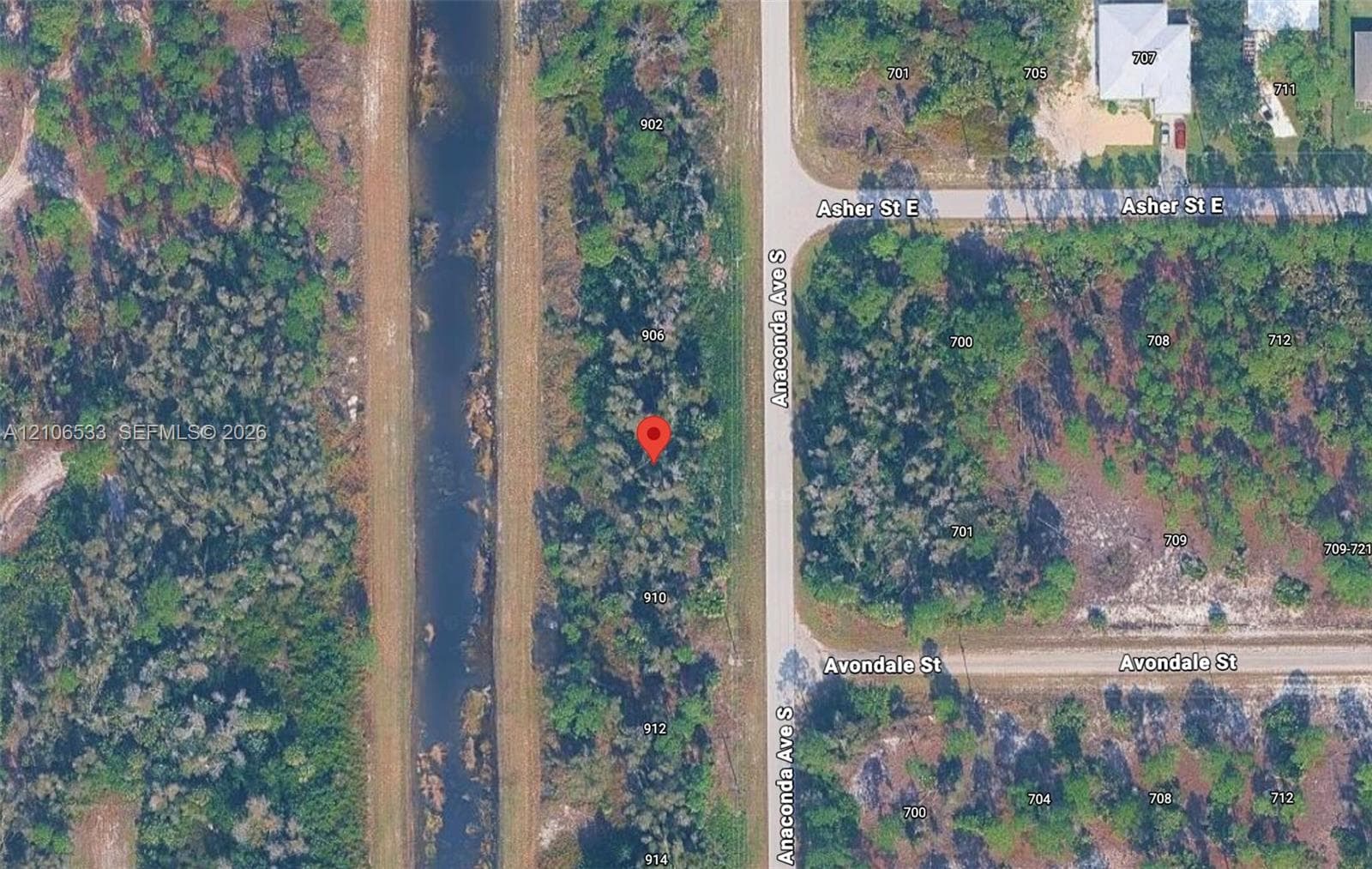 Aerial Property Survey. Illustrating the designated parcel boundaries and street orientation of the property